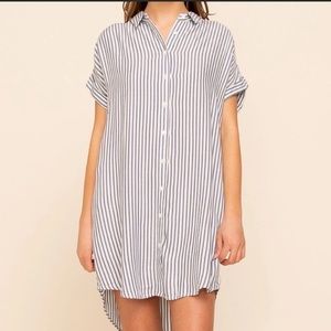 Thread + Supply dress featuring blue and white strips and pockets!